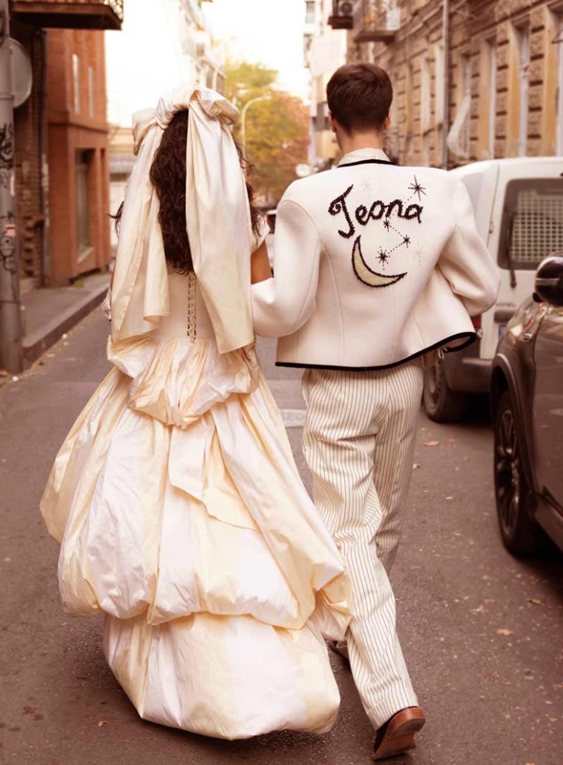 Creative couple working together fashion design studio