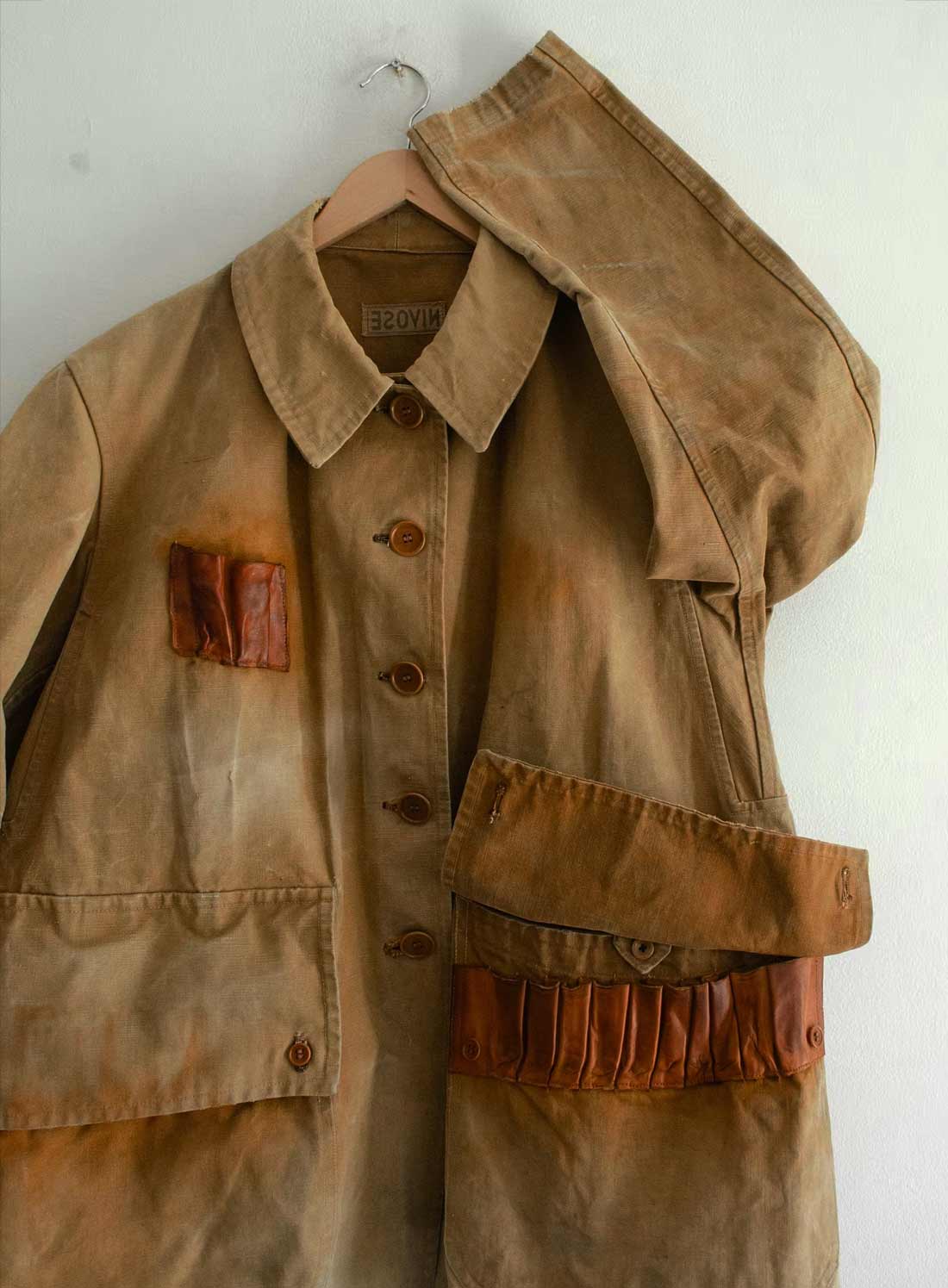 Distressed linen jacket texture detail